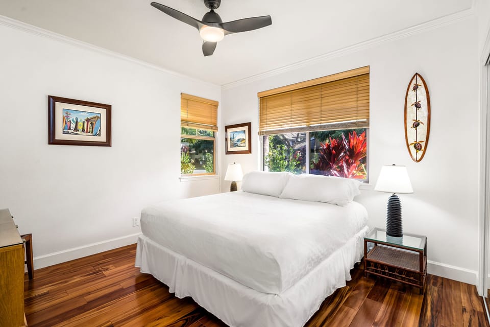 Secondary bedroom located downstairs with King bed, ceiling fan