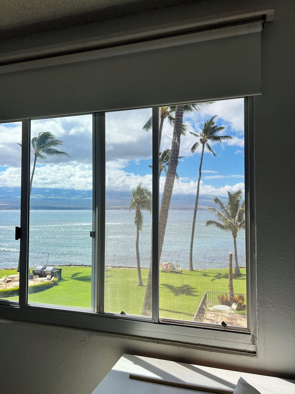 Primary bedroom window looking out to the ocean.