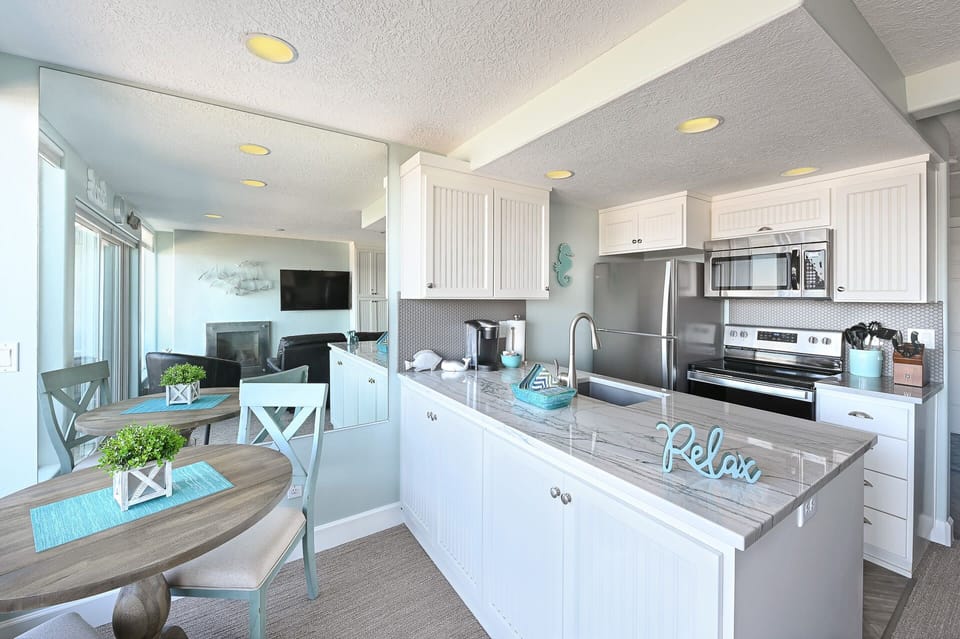 Bright open kitchen & dining space designed for easy meals and time together.