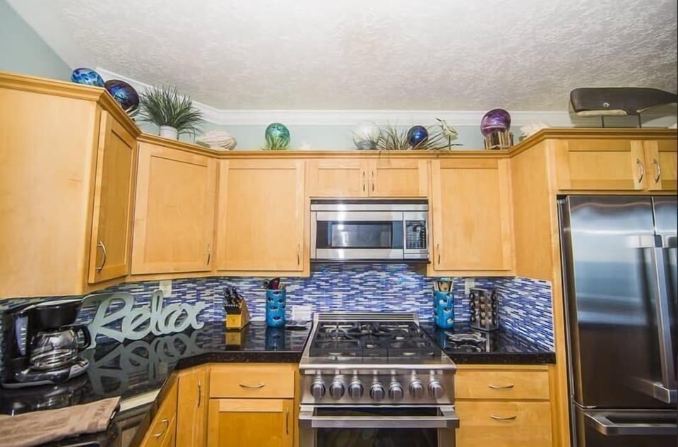 Kitchen range & cabinetry ready for home-cooked meals