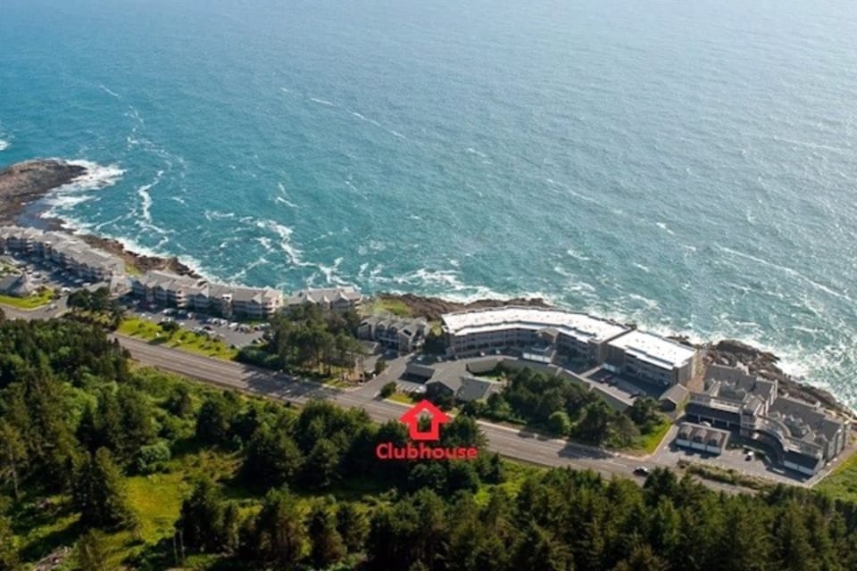 Aerial view showcasing the property perched along the coastline