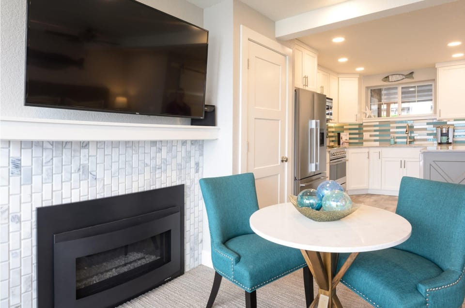 Cozy sitting nook by the fireplace for relaxed evenings indoors.