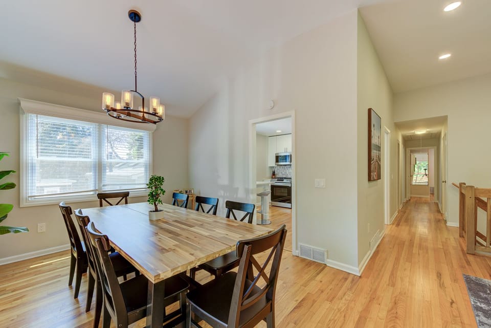 Dining table right next to the living room and kitchen.
