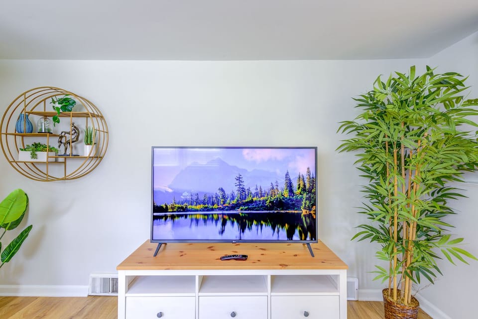 TV stand holds a 65-inch smart tv.
