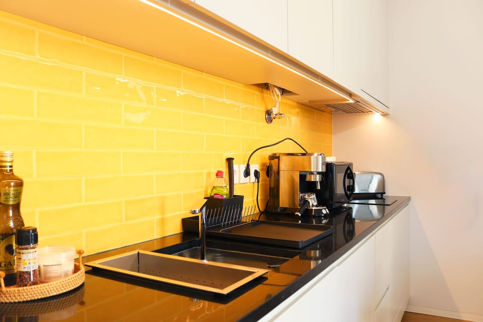 A coffee machine, water heater, toaster and micro-wave are included