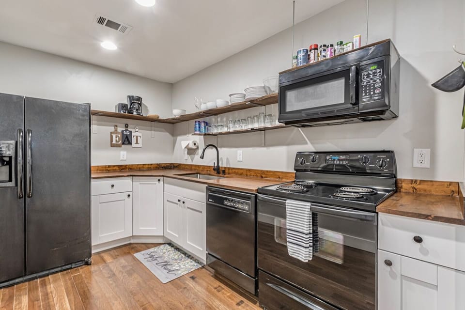 The second floor kitchen is fully stocked
