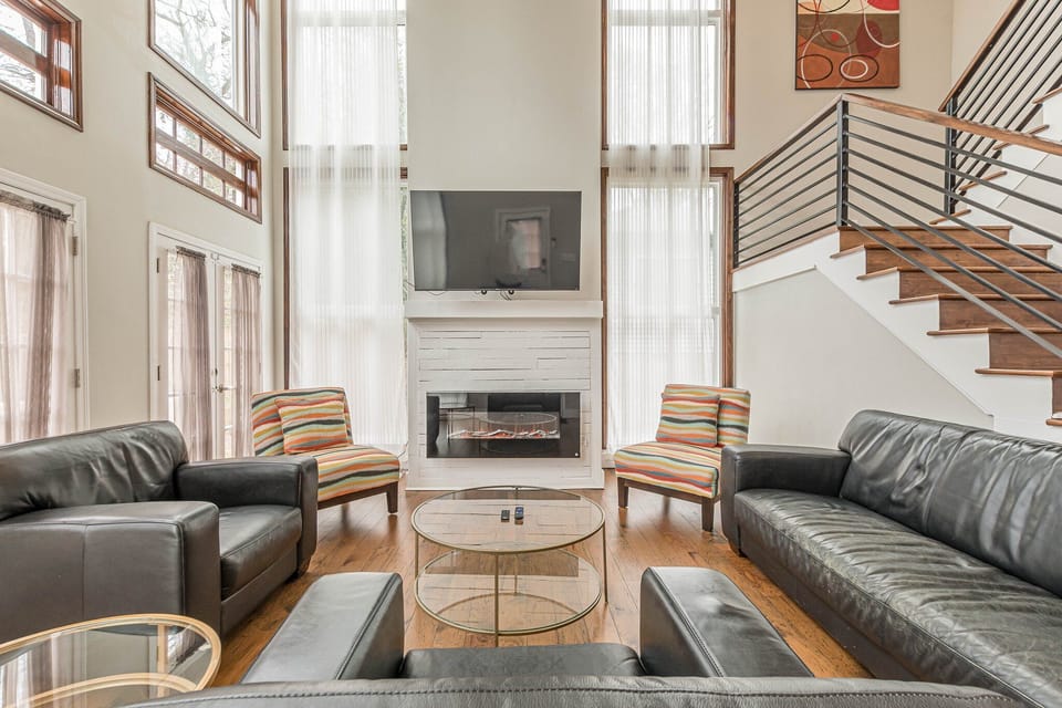 The great room has a fireplace and TV