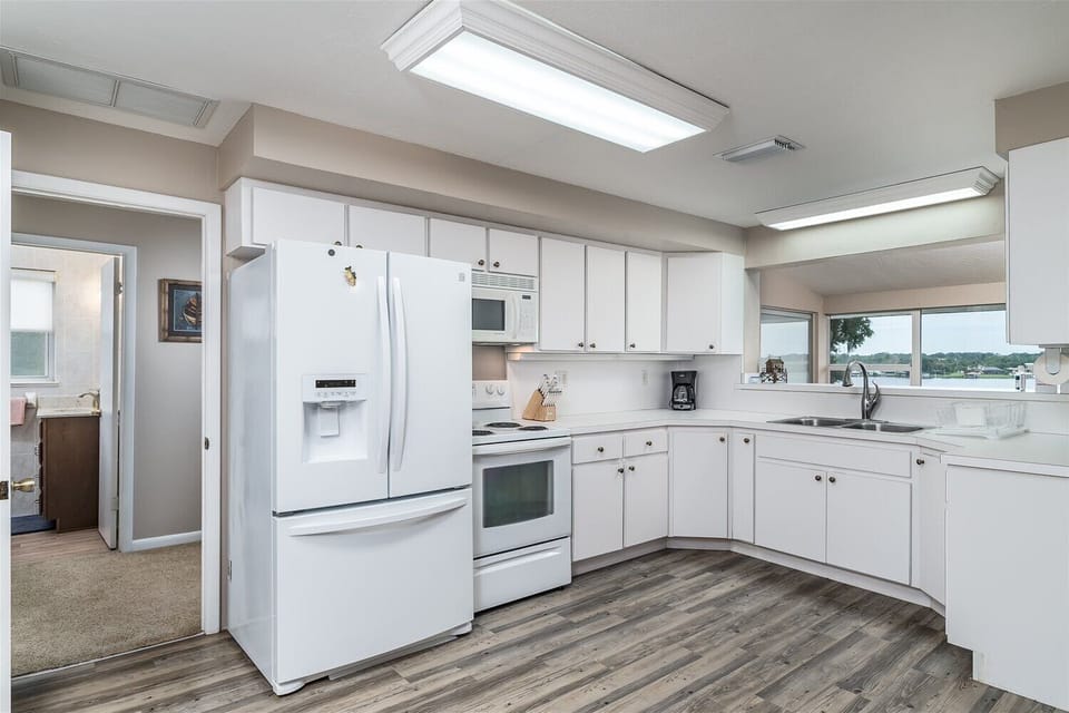 Main Floor: Bed 1 & 2 on left near kitchen.  Laundry room and Full Bath as well