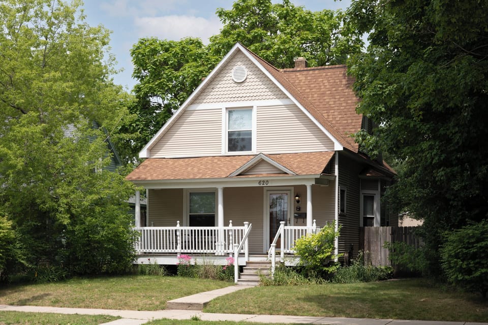 Charming exterior w/ welcoming porch & classic architectural details
