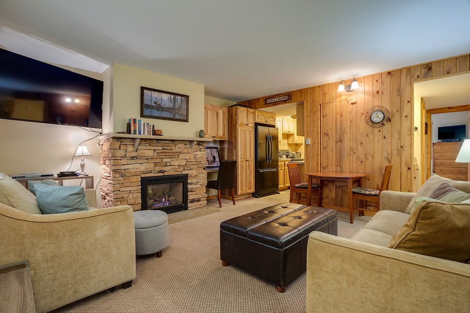 Cozy up by your stone fireplace while mountain charm surrounds you in warm wood and comfortable furnishings.
