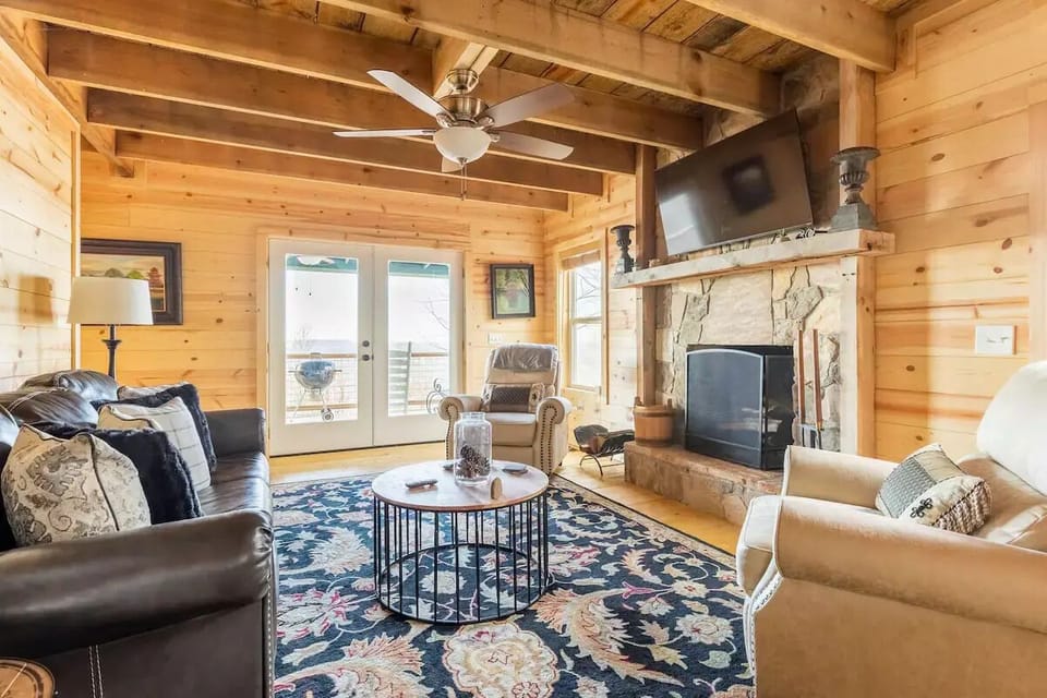 Your den is open concept with new furniture 55 inch Roku TV that streams Spectrum cable and a wood b