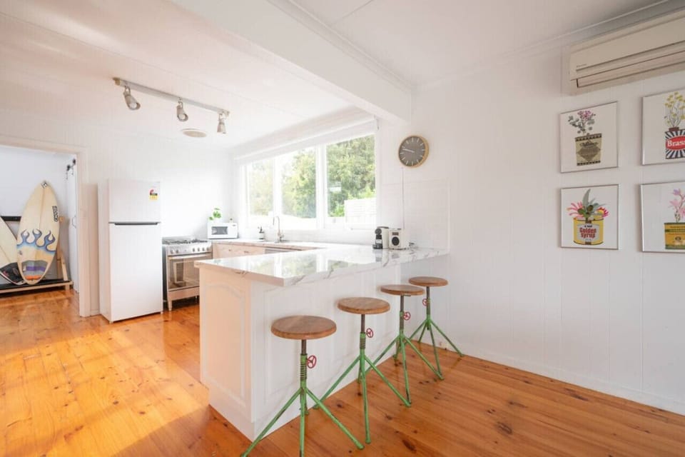 Fully-equipped kitchen with additional bench seating and butler`s pantry.
