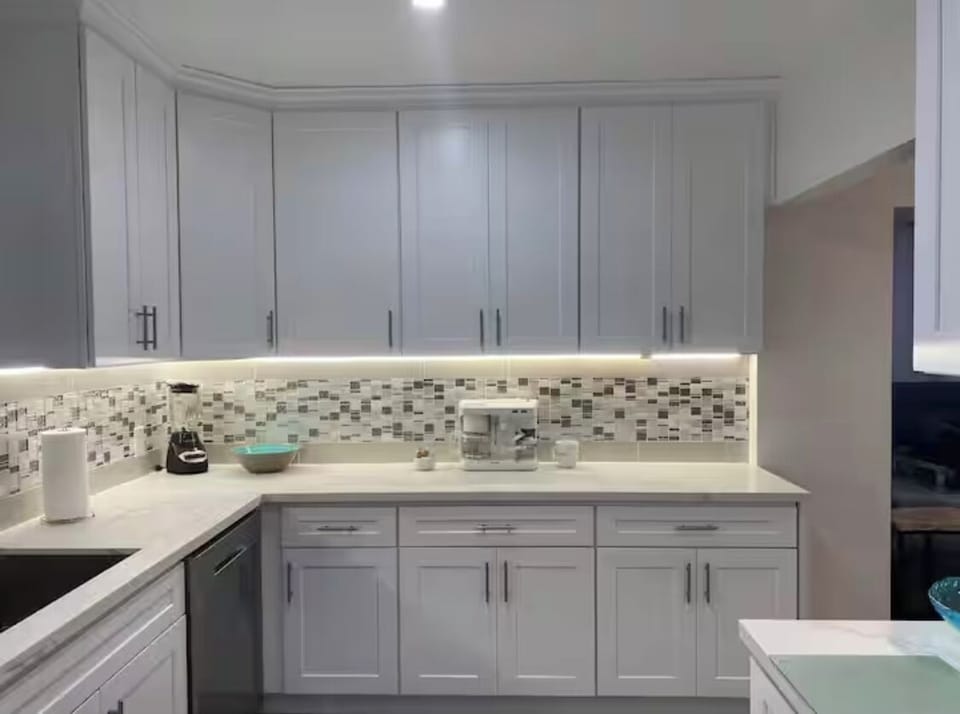 White quartz counters, under counter lights, 9” ceilings furnished  luxurious
