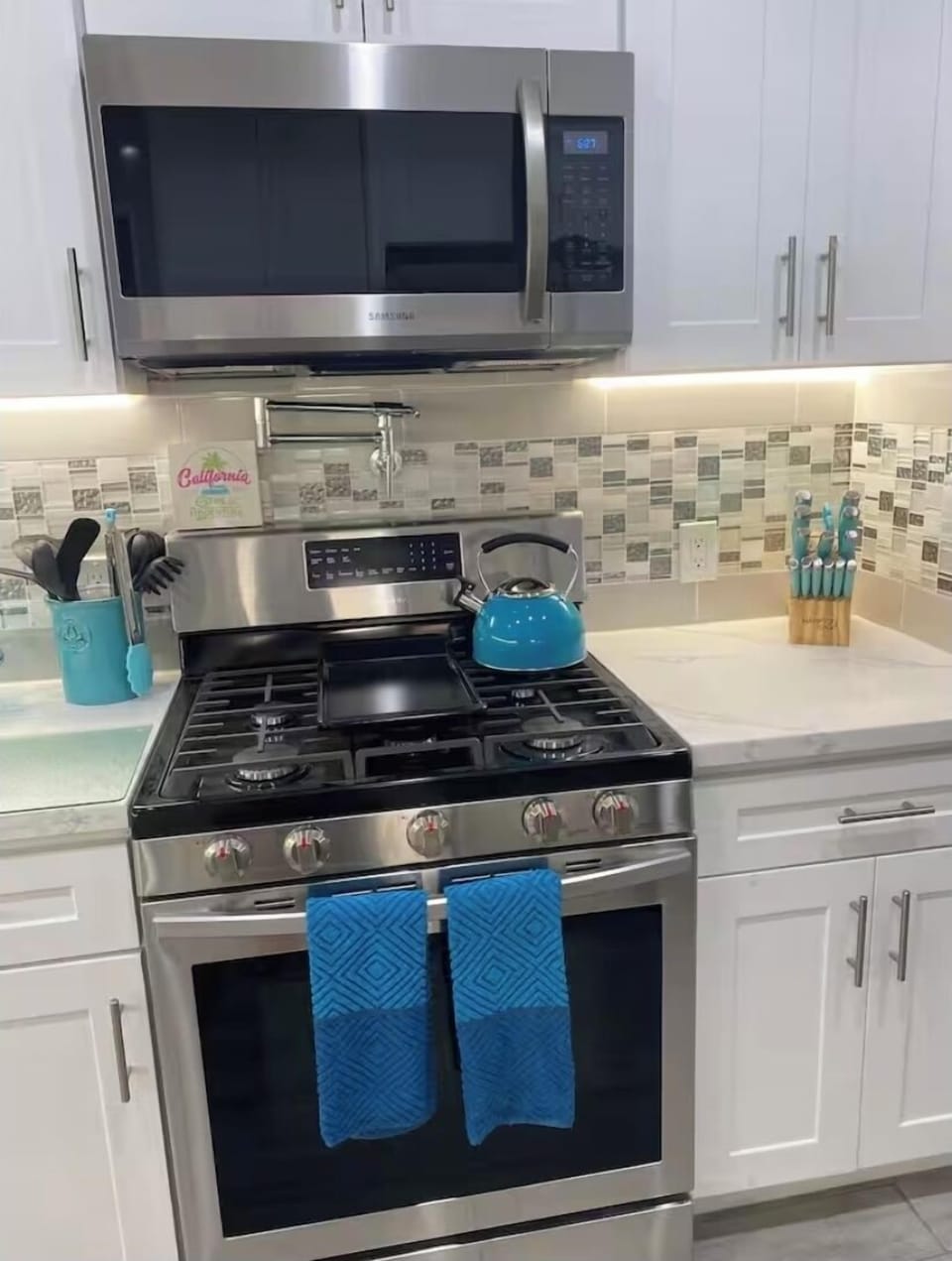 Gourmet kitchen, Pot filler, stainless gas 5 burner stove, stainless microwave