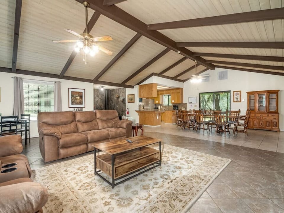 Cozy living room with 65" TV, and Roku.