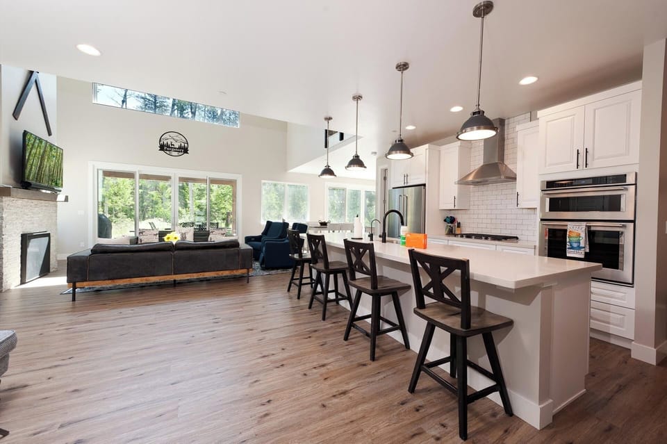 Main Living Space and Kitchen - TV, Gas Fireplace and tons of windows