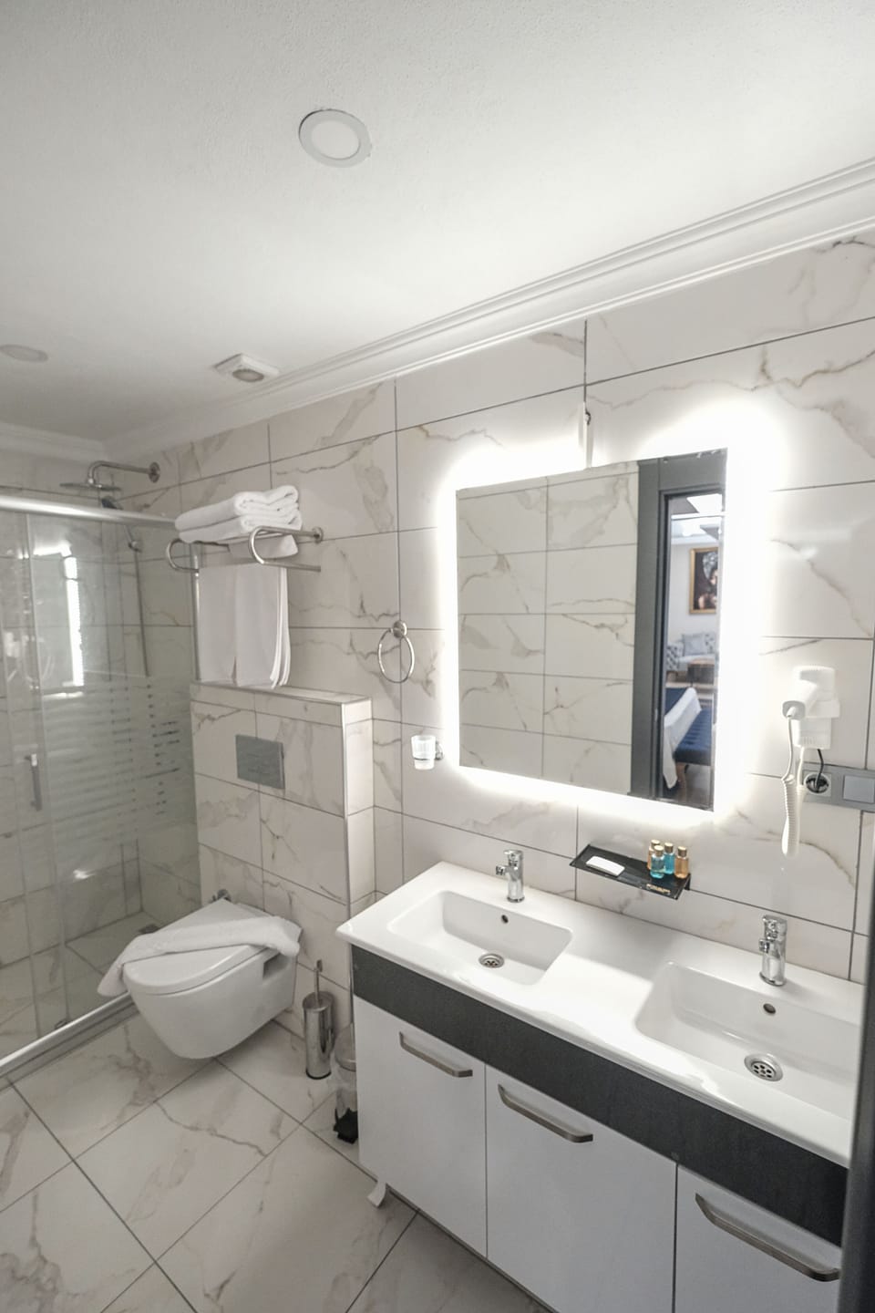 Shower, free toiletries, hair dryer, slippers