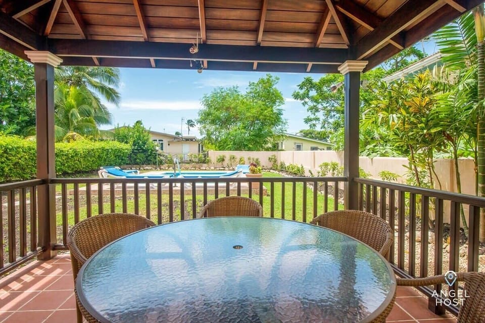 The covered patio dining table can seat 6 and has a lovely view of the pool!