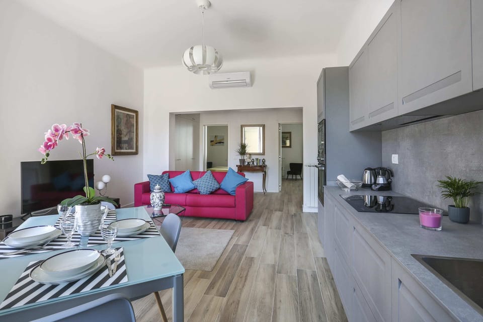 Basic Apartment, Multiple Beds | Living area | TV