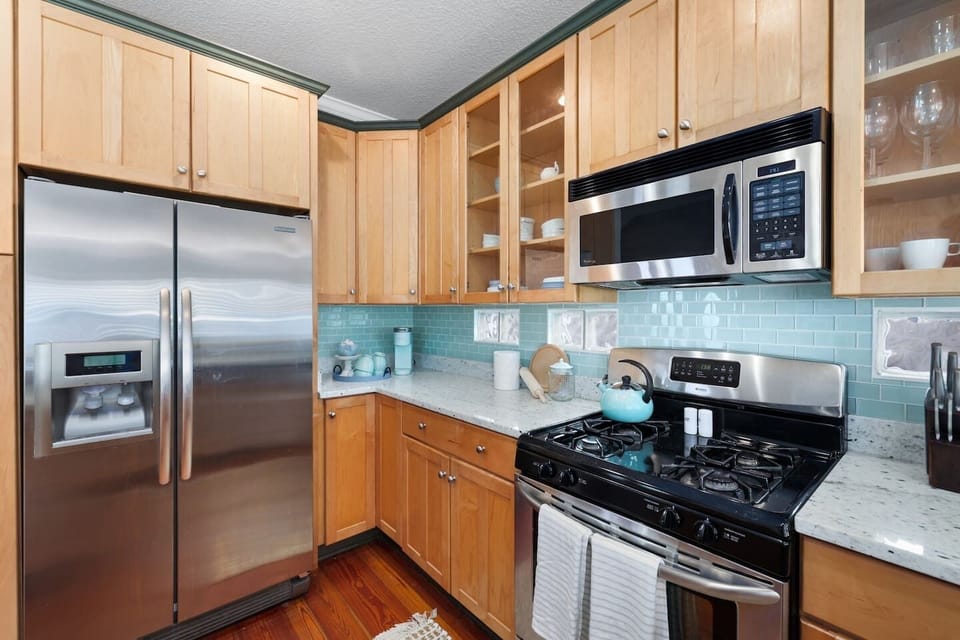 Fully stocked kitchen with stainless steel appliances