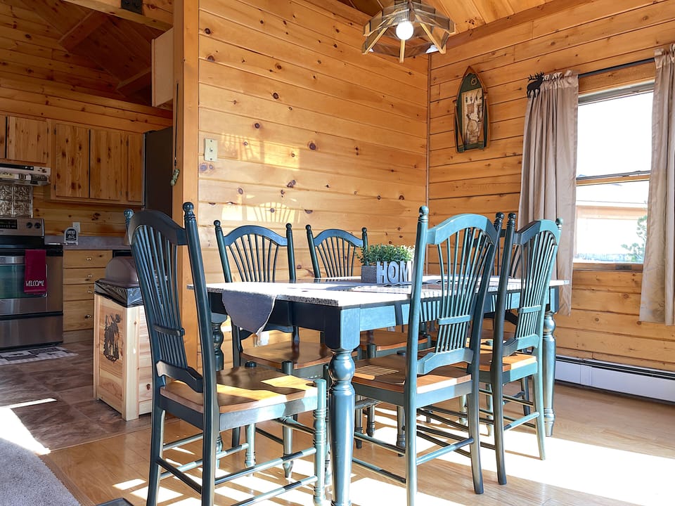 The bright dining area with seating for six is a great place to gather together