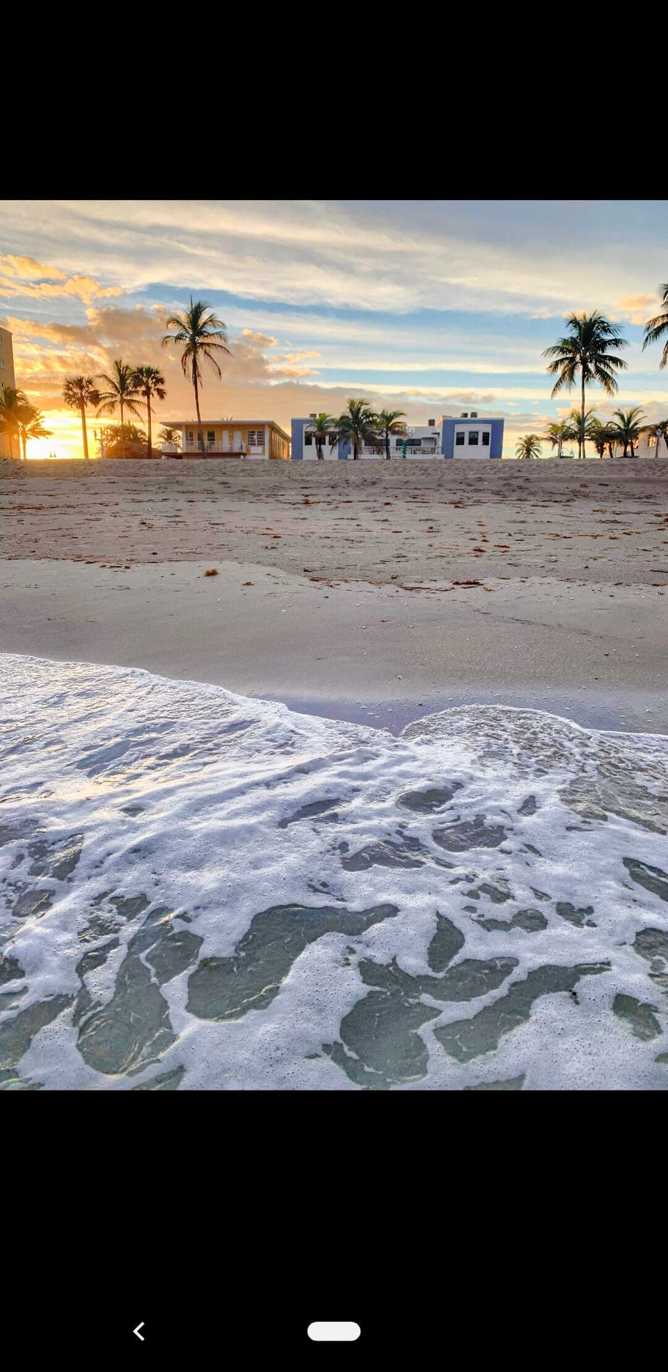 view of Sandpiper from the Ocean at sunset