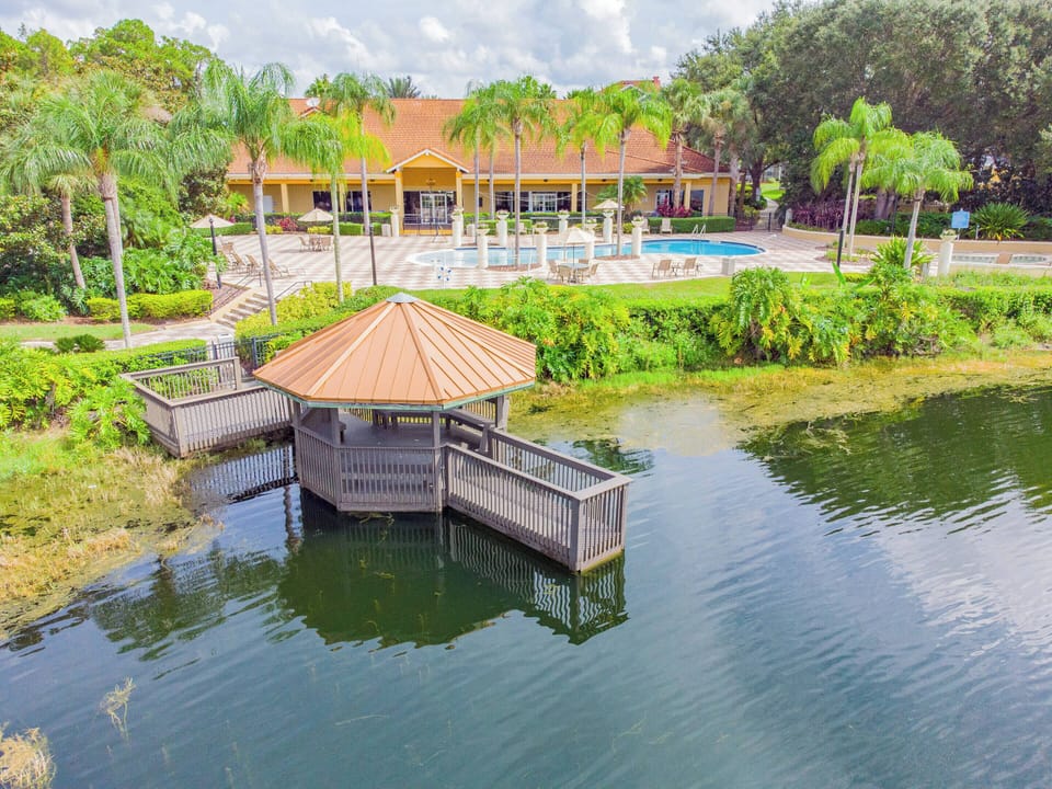 Enjoy serene water views from your private dock, framed by lush greenery. The charming gazebo invites you to relax, ideal for morning coffee or evening reflection after a day filled with adventure.