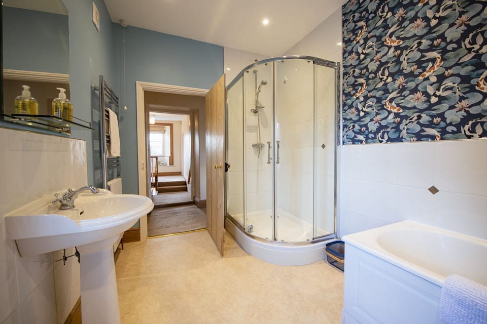 First floor: Family bathroom with large walk-in shower
