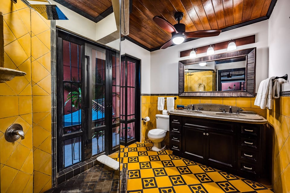 Master Bathroom. - Luxury shower and double sinks and opens to  tropical garden and private patio.