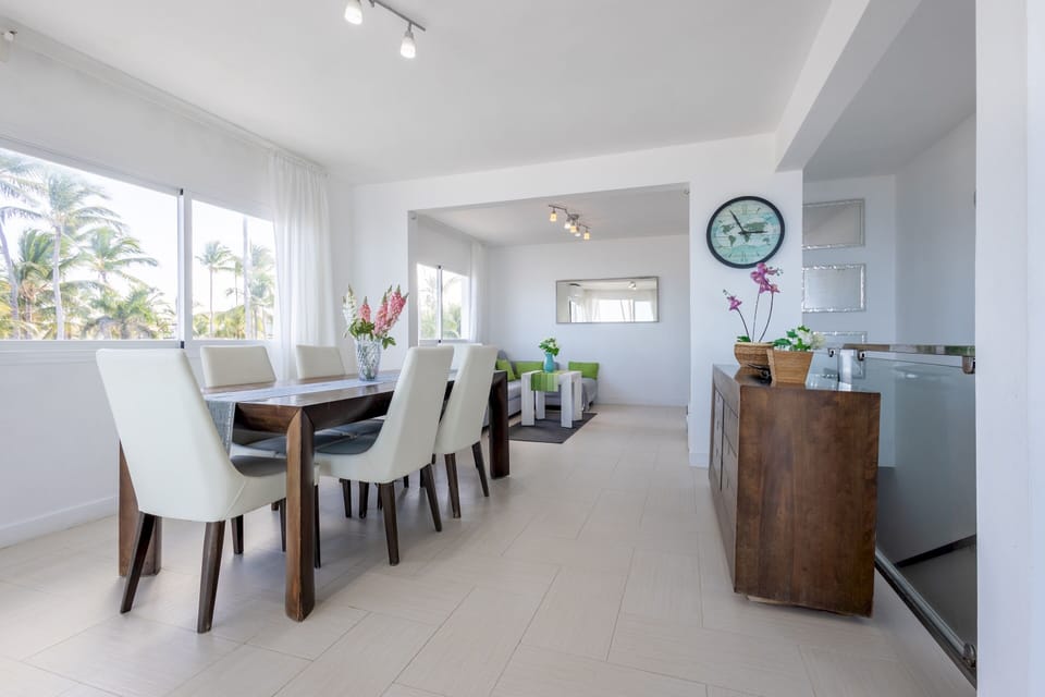 Unwind in the cozy living room with a plush sofa and the TV.