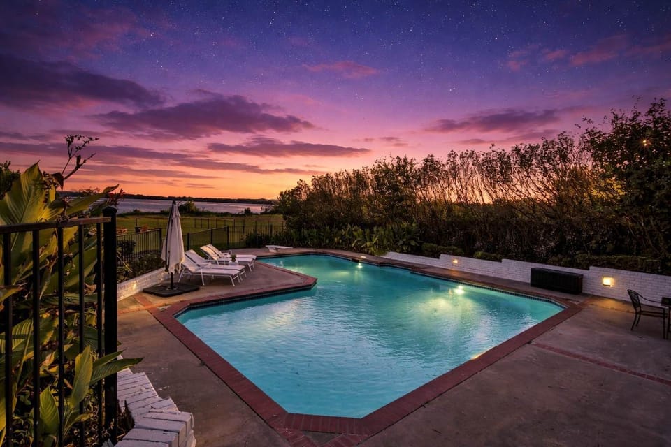 Relax by your private pool right by the lake, where sunset views and peaceful waterfront scenery create a true resort-style escape.