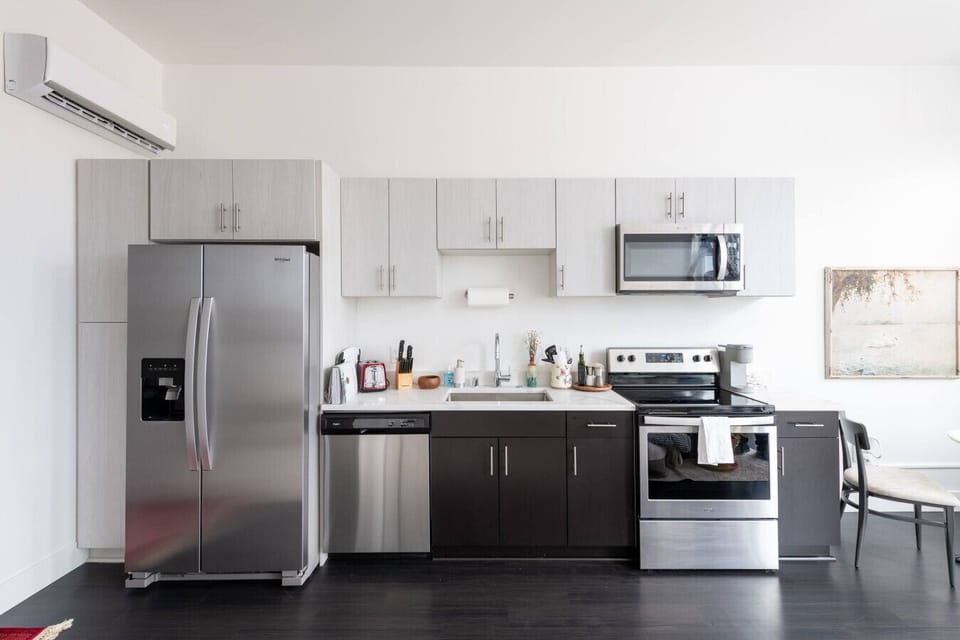Cook, dine, and connect. Our modern kitchen comes with everything you need to whip up a gourmet meal at home