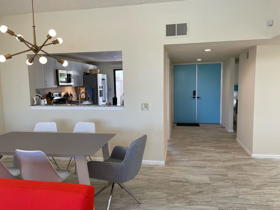 View of the kitchen and front door from the living room