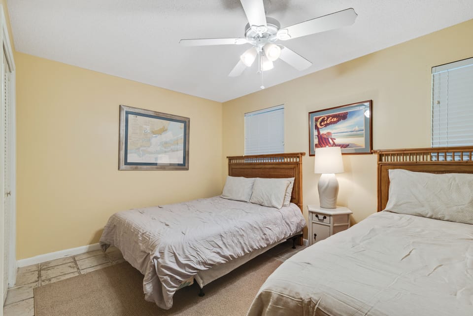 Thoughtfully designed for our guests. This bright and comfortable bedroom provides a serene retreat, offering two cozy Queen-sized beds and a welcoming atmosphere for a restful night's sleep after a day of coastal adventures.