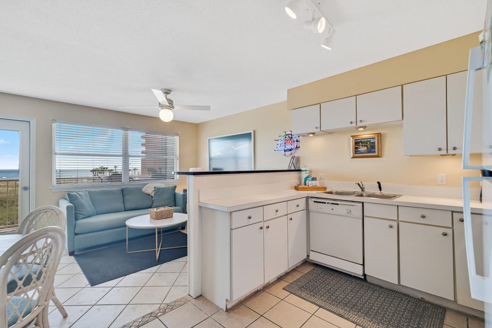 Enjoy the comforts of home, even on vacation. Our well-appointed kitchen at Summer Breeze Condominiums offers everything you need to brew your morning coffee, prepare snacks, or cook a full family dinner after a day at the beach.