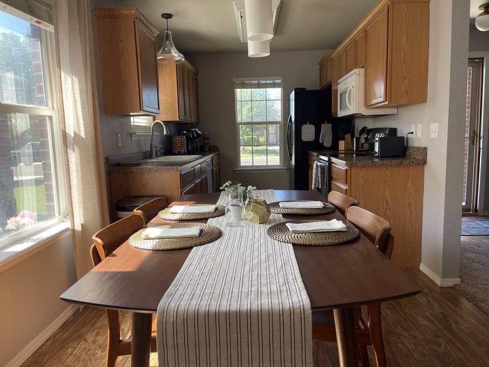 Dining area looking to kitchen