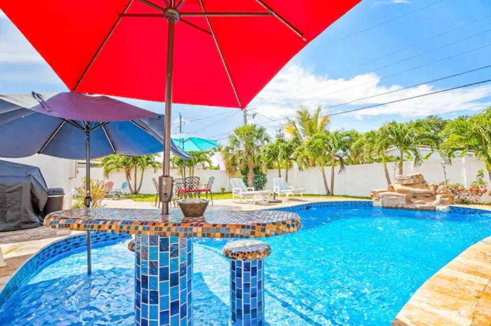 Bar Sitting inside the pool with Umbrella.