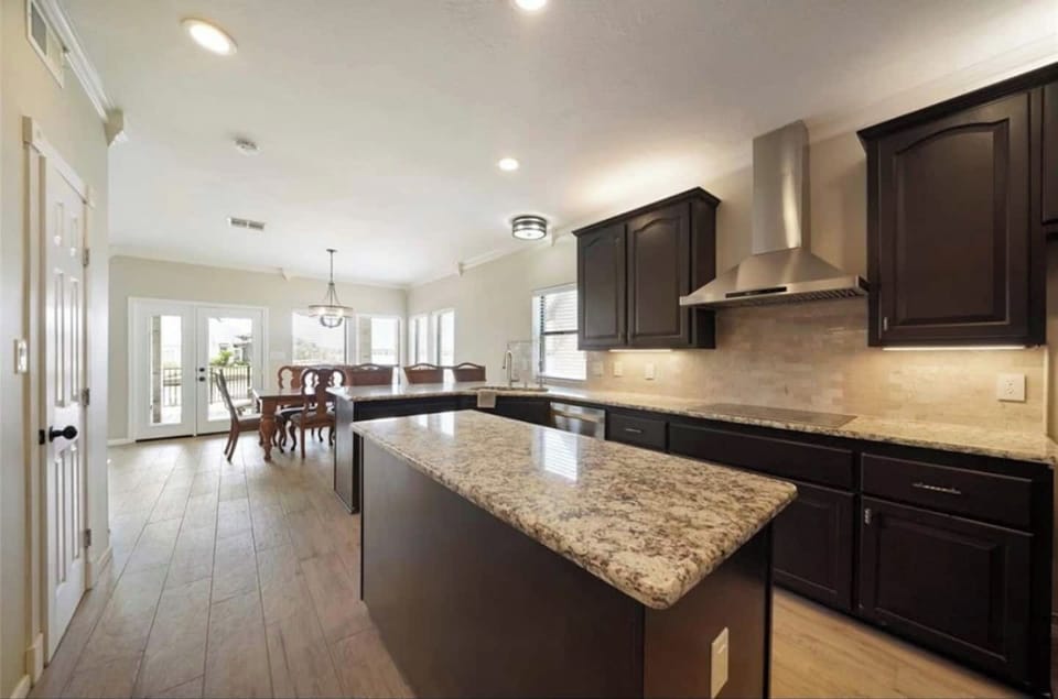Fully stocked kitchen with bar and island.   A second fridge is located in the garage space.