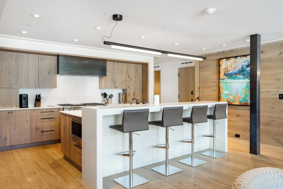 Kitchen with Bar Seating and Range