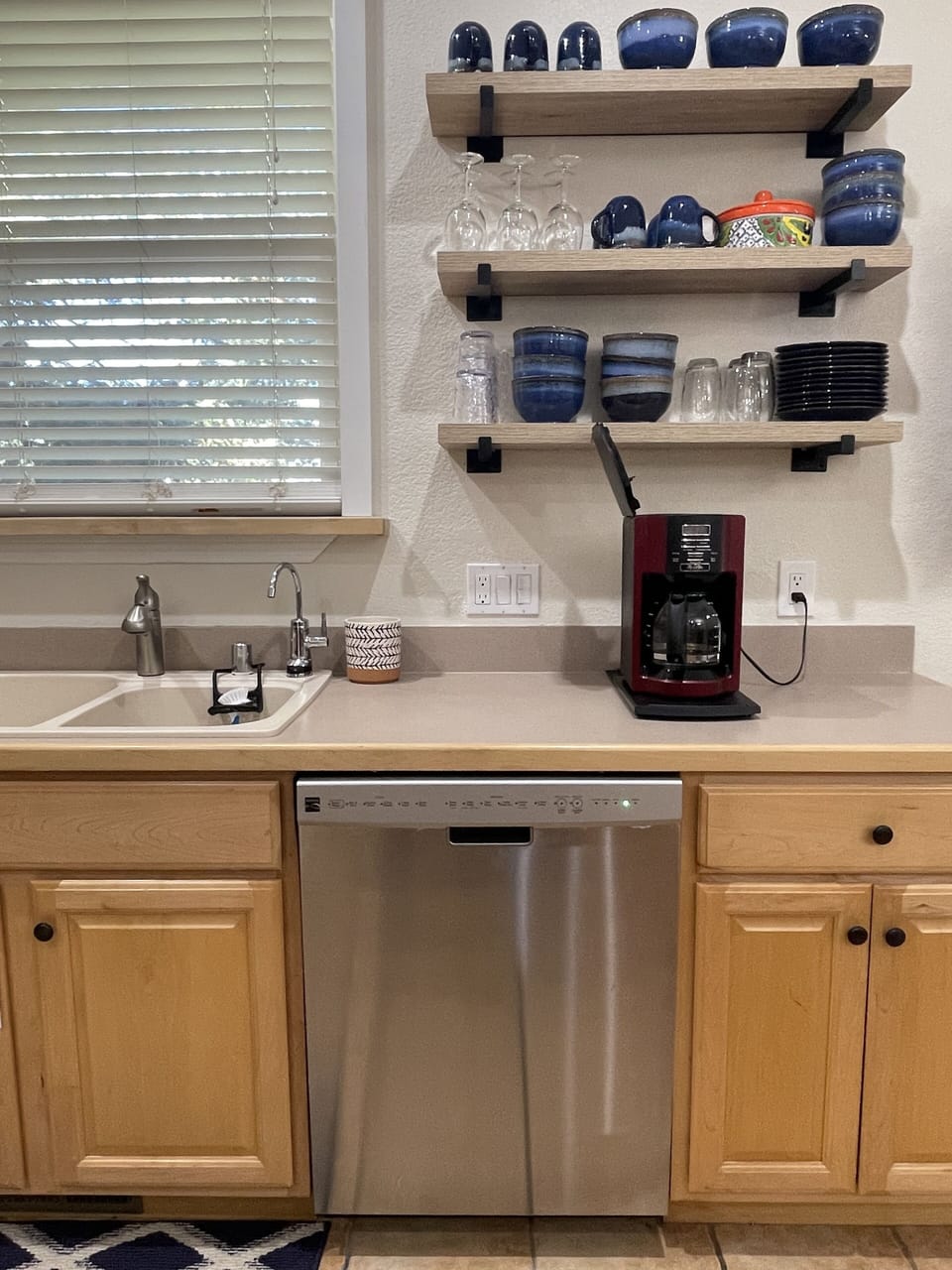 Kitchen features dishwasher for easy cleanup after meals. 