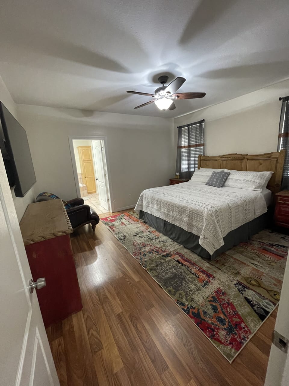 Bedroom 1 features a king-sized bed and en-suite bathroom and walk-in closet. 