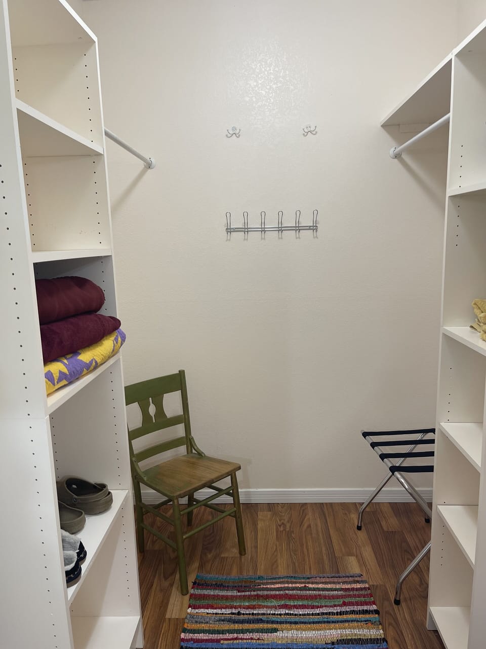 Walk-in closet situated off bedroom 1.