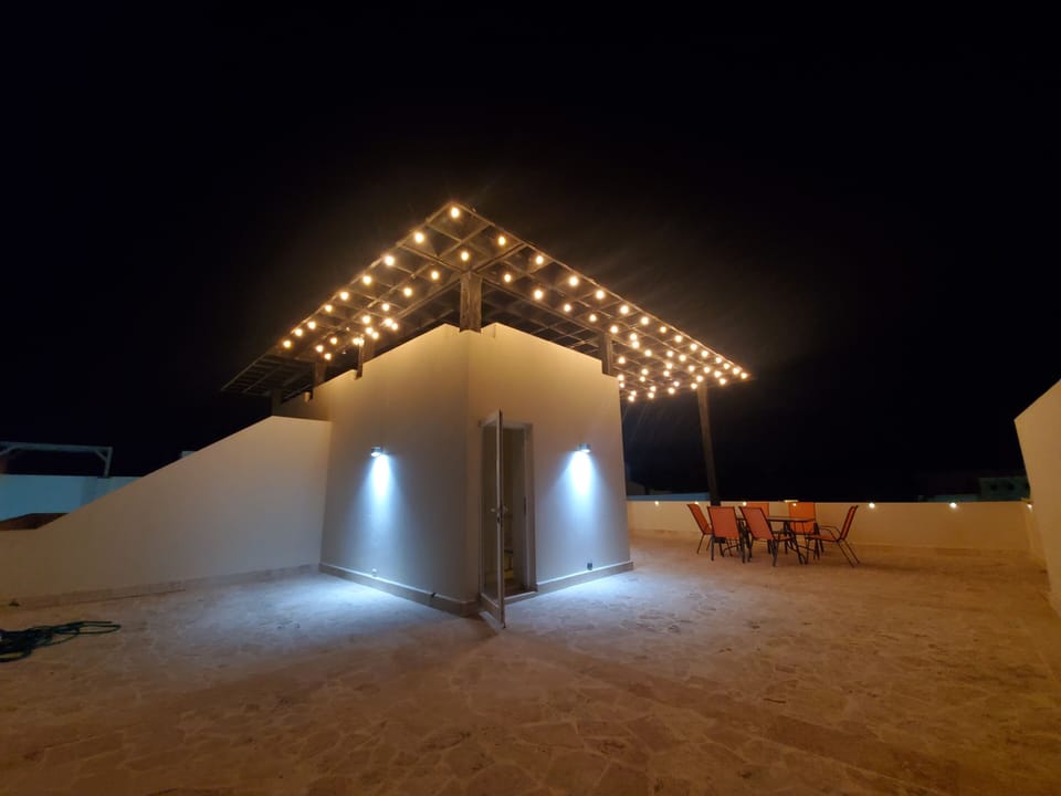 Private Rooftop .lights On  enjoy the night breeze.