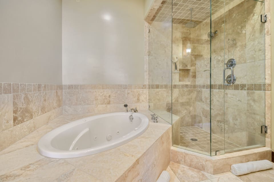 Relax in the jetted soaking tub or refresh in the separate glass walk-in shower after a day on the slopes.