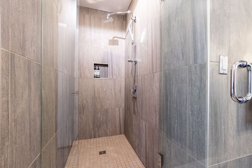 Updated bathroom with walk-in shower and elegant tilework