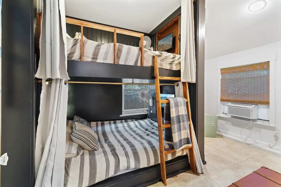 Cozy private bunk beds with personal lights and curtains for a peaceful night’s sleep.
