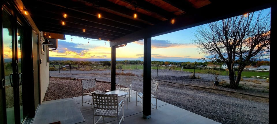 Back patio. Gorgeous sunset and pasture views. Gas grill and patio furniture. 