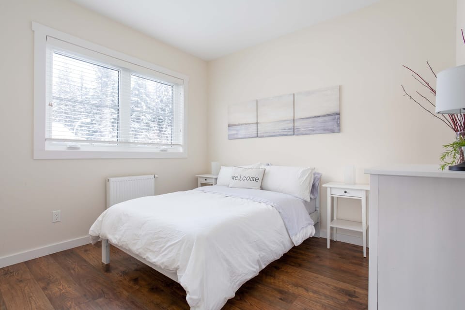 First bedroom with a double bed.  Windows open to allow fresh mountain air in.