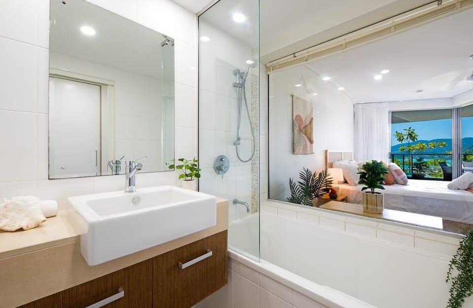 Soak away the day in the primary ensuite bath while admiring stunning Coral Sea views.
