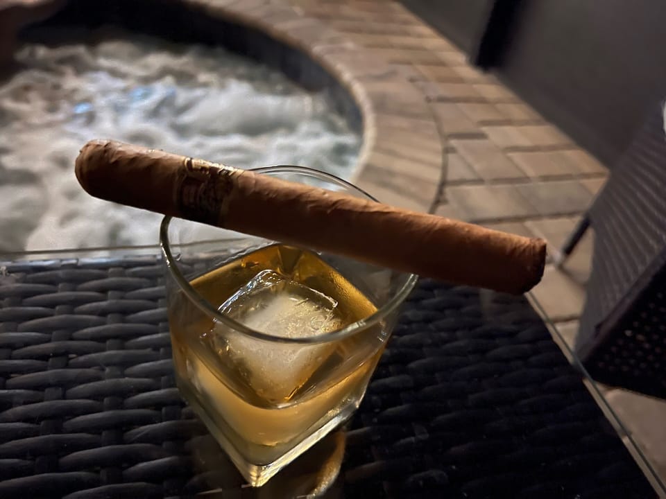 Enjoy a glass of your favorite beverage by the spa!